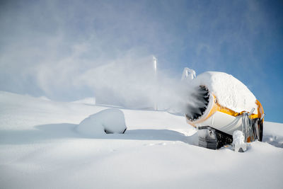Snowmaking snow guns at work in gastein ski resort, salzburg, austria