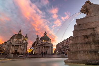 Low angle view of historic building against sky during sunset