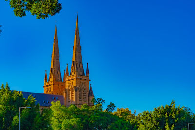 Low angle view of cathedral against blue sky