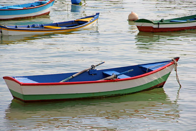 Fishing boats moored in lake