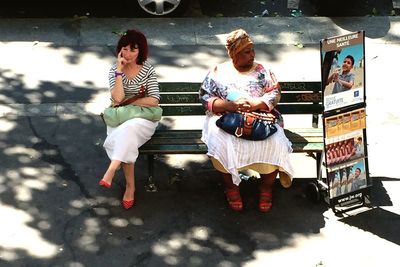 Young couple sitting outdoors