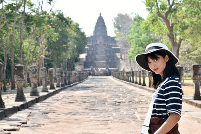 Mid adult man standing in temple