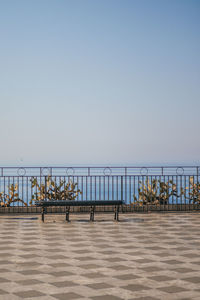 Pier over sea against clear sky