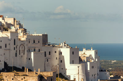 High angle view of buildings in city against sky