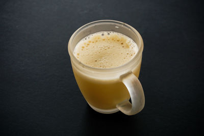 Close-up of coffee cup on table