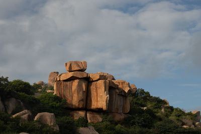 Low angle view of rocks against sky