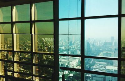 Cityscape seen through glass window