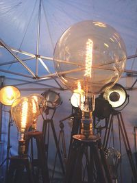 Close-up of illuminated ferris wheel at night