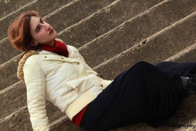 Low section of woman lying on floor