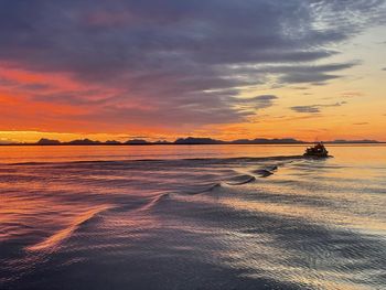 Scenic view of beach against sky during sunset