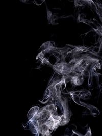 Close-up of fire over black background