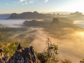 Scenic view of mountains against sky during sunset