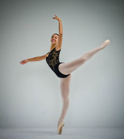 Ballerina posed in studio shooting for dance audition 