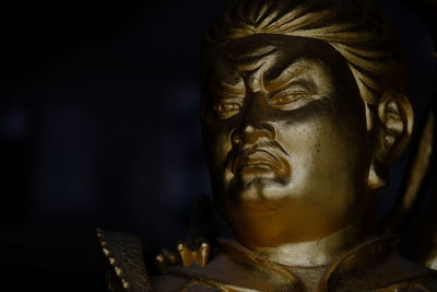 Close-up of gold statue