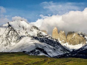 Panoramic view of snowcapped mountains against sky