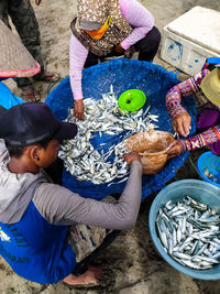 High angle view of people in toy for sale