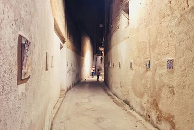 Narrow alley amidst buildings in city