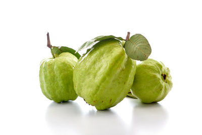 Close-up of fruits against white background