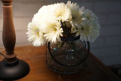 Close-up of white flower vase on table