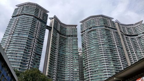 Low angle view of modern buildings against sky in city