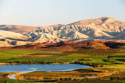 Scenic view of lake with mountain range in the background, morocco 