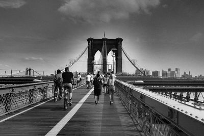 People walking on footbridge