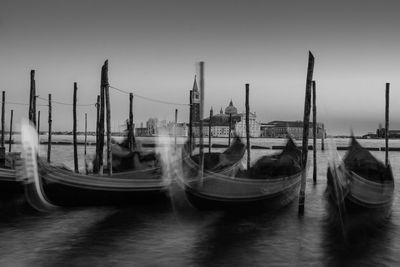 Boats moored in water