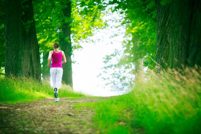 Woman running on grass