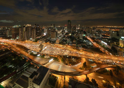 High angle view of illuminated buildings in city at night