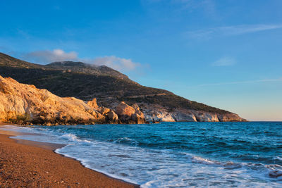 Scenic view of sea against blue sky