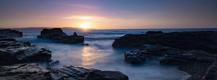 Scenic view of sea against sky during sunset