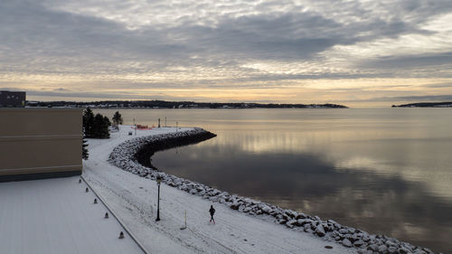 Scenic view of lake against sky during sunset