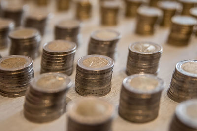 High angle view of coins and glasses on table
