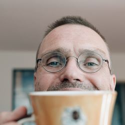 Close-up portrait of man wearing eyeglasses