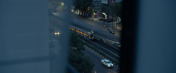 High angle view of vehicles on road in city