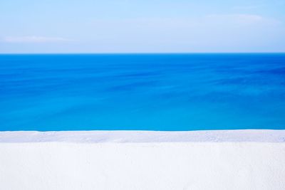 Scenic view of swimming pool by sea against sky