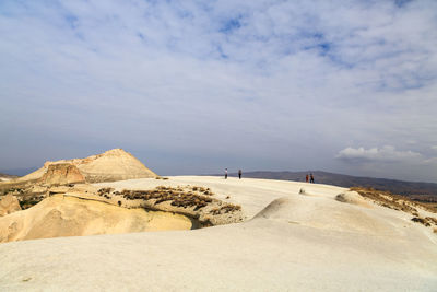 Scenic view of landscape against cloudy sky