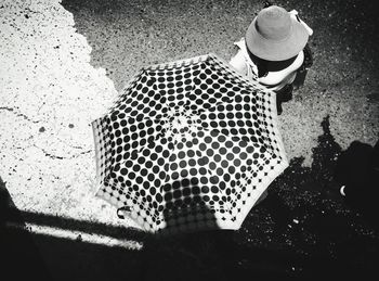 High angle view of woman standing on street