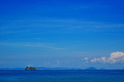 Scenic view of sea against blue sky