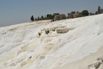 Scenic view of land against clear sky