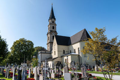 Panoramic view of cemetery against buildings