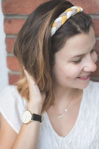 Close-up portrait of a smiling young woman