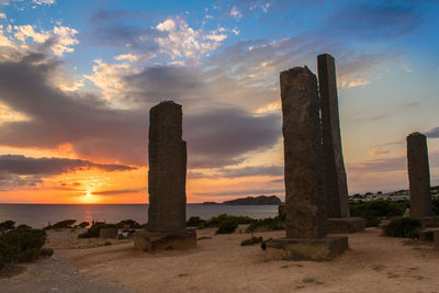 Ibiza, spain, october 23 2021, beautiful sunset near the stonege monument of ibiza at cala llentia