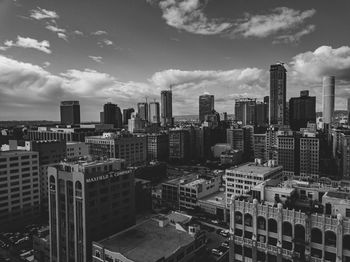 High angle view of buildings in city against sky