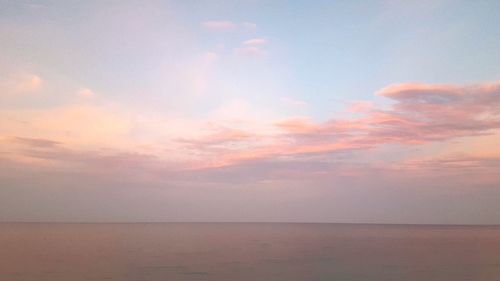 Scenic view of sea against sky at sunset