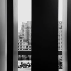 Modern office building against sky seen through window