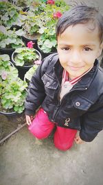 Portrait of cute baby girl with plants