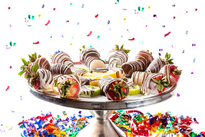 Close-up of multi colored candies on table
