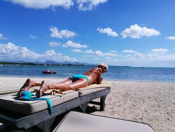 Woman lying on beach