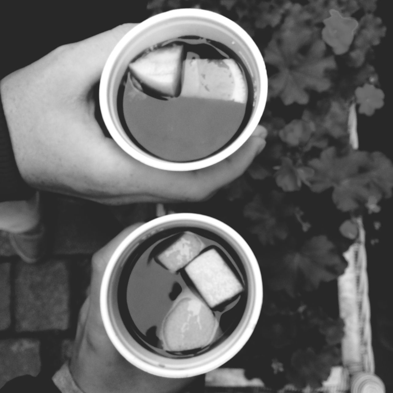 drink, coffee cup, refreshment, indoors, cup, coffee - drink, close-up, food and drink, coffee, saucer, circle, table, freshness, holding, focus on foreground, person, part of, still life